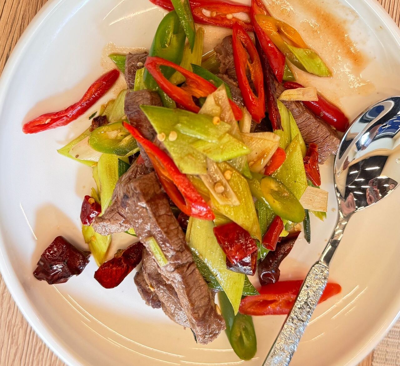Sliced beef stir-fried with green and red chillies.